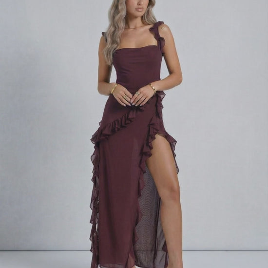 Lauven Amaranth Maxi Dress in deep plum with sheer ruffles and a thigh-high side slit, showcasing elegant style.