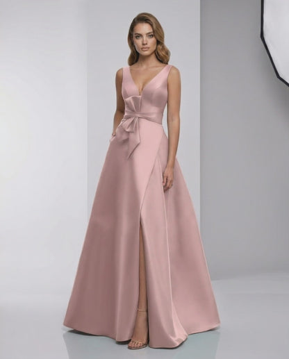 Roselle Maxi Dress in pink satin with A-line silhouette, V-neck, and elegant bow detail by Lauven.