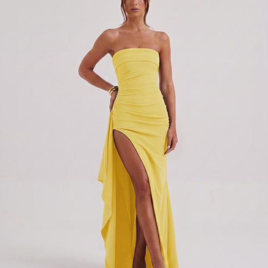 Solenne Maxi Dress in yellow, strapless design, dramatic side slit, by Lauven, elegant and modern look.