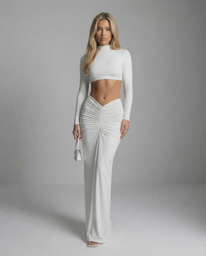 Celeste Maxi Dress by Lauven – Sleek white ankle-length dress with long sleeves and ruching detail.