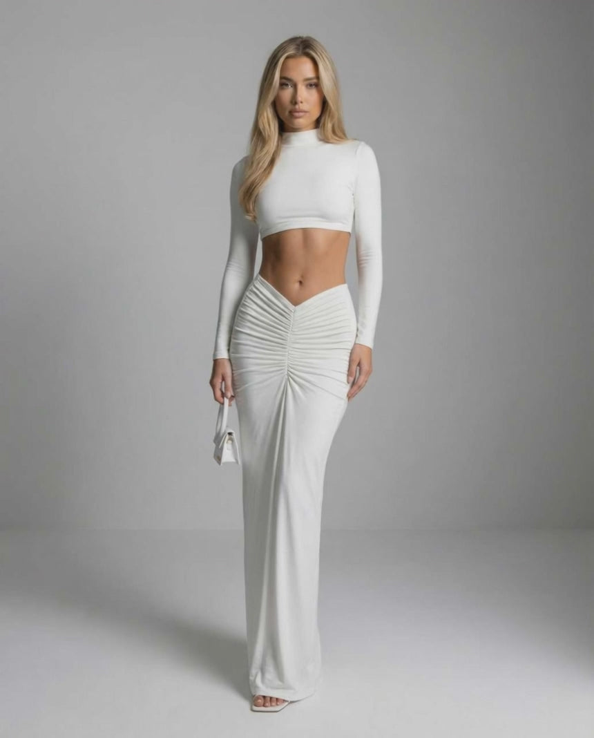 Celeste Maxi Dress by Lauven – Sleek white ankle-length dress with long sleeves and ruching detail.
