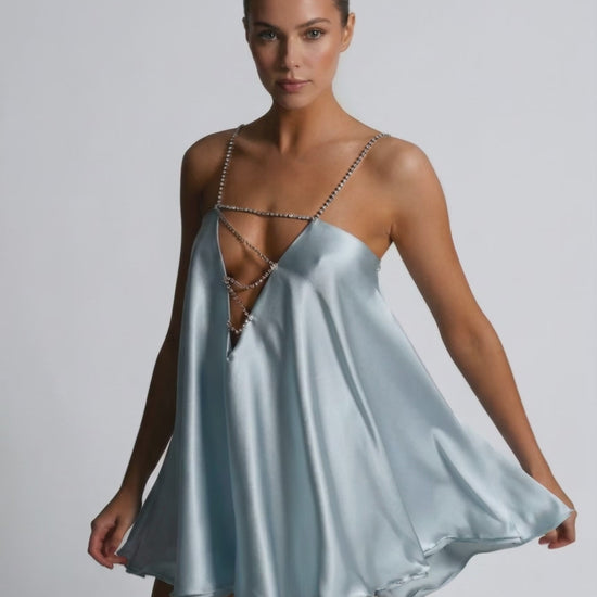 Celeste Mini Dress by Lauven in soft sky blue satin with rhinestone detailing, featuring an airy A-line cut.