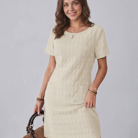 Avelin Mini Dress by Lauven, featuring textured fabric, round neckline, and a stylish mini length for warm weather.
