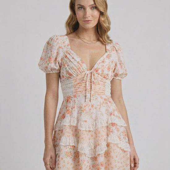 Coral Mini Dress by Lauven, featuring soft floral print, tiered ruffles, and a flattering A-line silhouette, perfect for a romantic look.