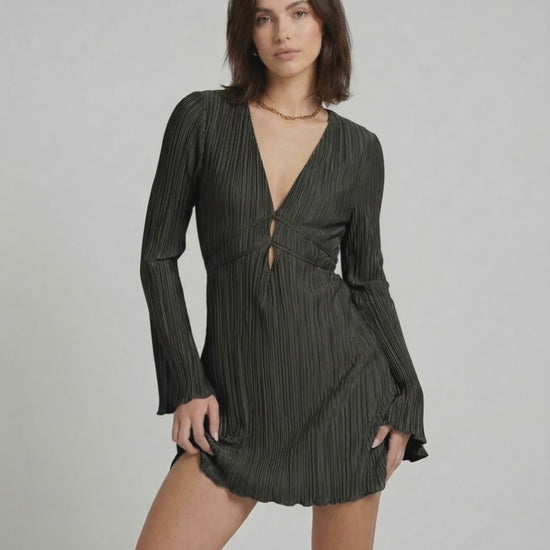 Noir Mini Dress by Lauven – Pleated long sleeve mini dress in classic black with deep V-neckline.