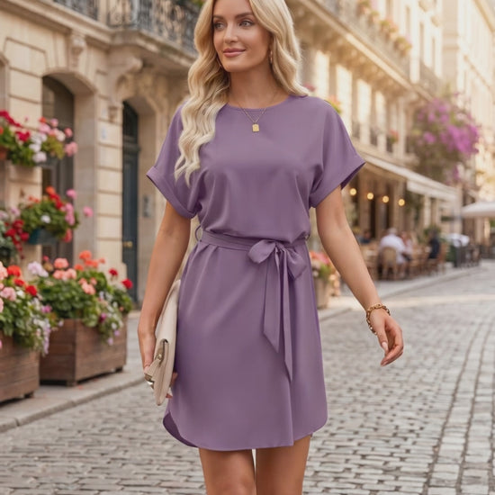 Elara Mini Dress in soft purple, featuring smooth woven fabric, round neckline, tied waist belt, by Lauven.