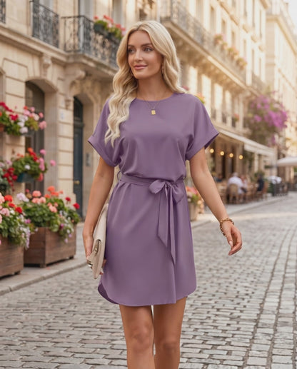 Elara Mini Dress in soft purple, featuring smooth woven fabric, round neckline, tied waist belt, by Lauven.