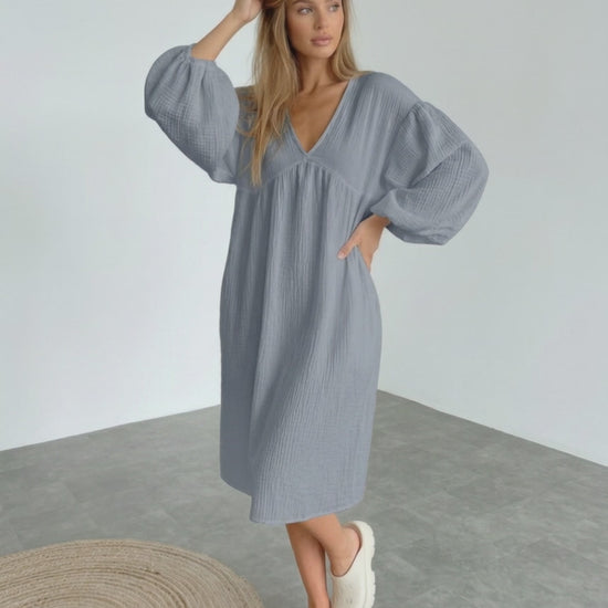 Orion Midi Dress in gray cotton, featuring puff sleeves and a v-neck design for a modern, minimalist look by Lauven.