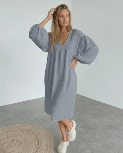 Orion Midi Dress in gray cotton, featuring puff sleeves and a v-neck design for a modern, minimalist look by Lauven.