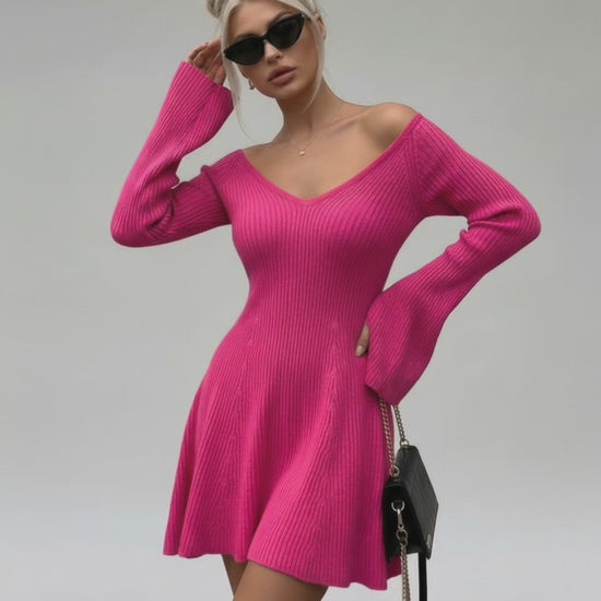 Model wearing Fiora Mini Dress by Lauven, a slim fit pink knit dress with V-neck and flared sleeves.