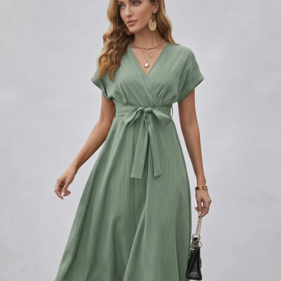 Serene Midi Dress in green, featuring pleated fabric, V-neck, A-line silhouette, and adjustable self-tie belt from Lauven.