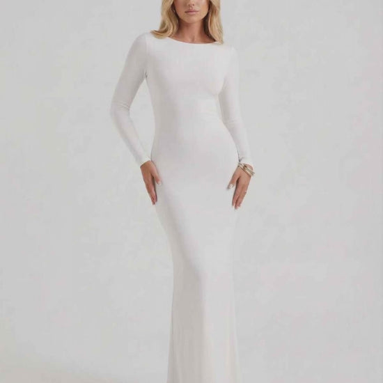 Lauven Celeste Maxi Dress in elegant white with long sleeves and open back, perfect for formal occasions.