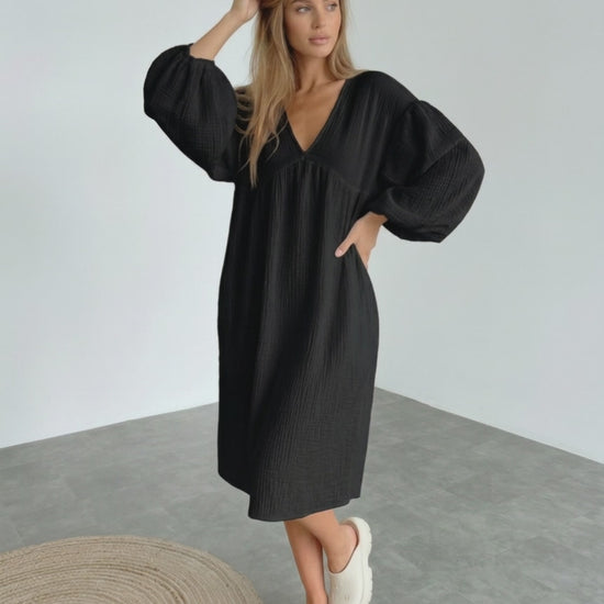 Noir Midi Dress by Lauven, black cotton dress with puff sleeves, v neck, elegant and comfortable for modern style.