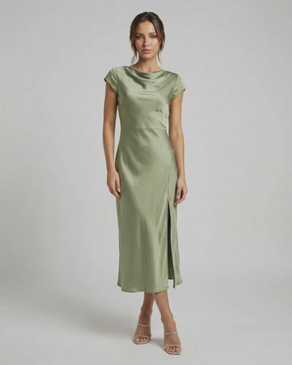 Virgo Midi Dress in soft sage green, featuring sleek satin fabric, twisted-back, and elegant cowl neck by Lauven.