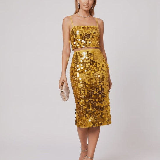 Lustra Sequin Set by Lauven, high-shine two-piece with reflective sequins, elegant cropped top and midi skirt.