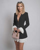 Noir Mini Dress by Lauven featuring ruffle contrast, deep V-neck, and sleek black silhouette for a sophisticated look.