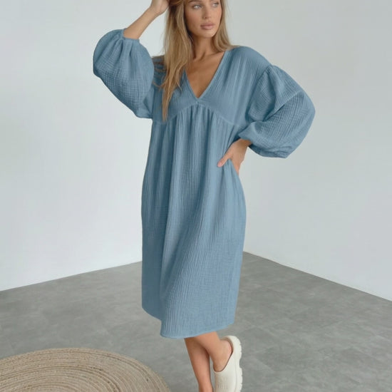 Aurelia Midi Dress in blue cotton, featuring puff sleeves and a flattering v neck, offering comfort and elegance by Lauven.