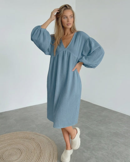 Aurelia Midi Dress in blue cotton, featuring puff sleeves and a flattering v neck, offering comfort and elegance by Lauven.