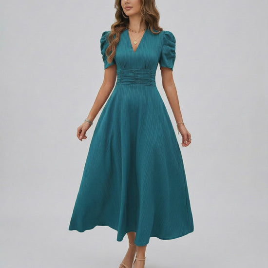 Zahara Midi Dress Teal midi dress with puff sleeves, flattering V-neck, and cinched waist by Lauven, perfect for weddings.