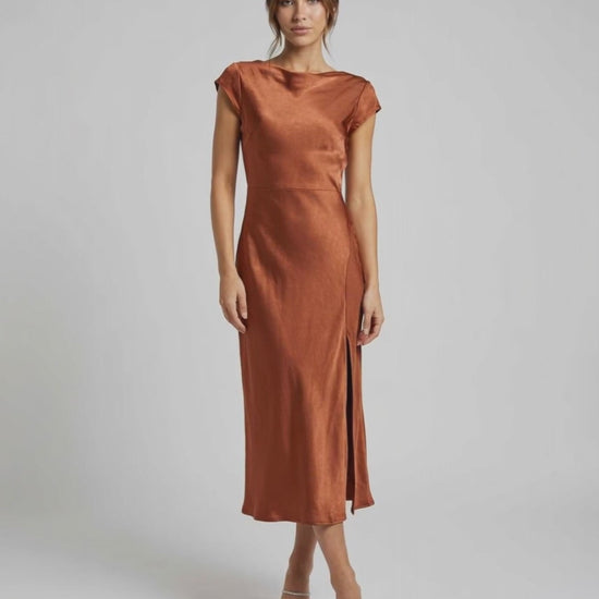 Seren Midi Dress in rich rust with elegant satin, twisted-back, cutout detail, and flattering fit by Lauven.