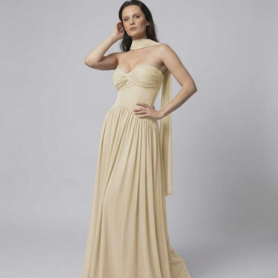 Elara Maxi Dress – Elegant beige strapless dress with choker scarf by Lauven, featuring a flowing skirt and fitted bodice.