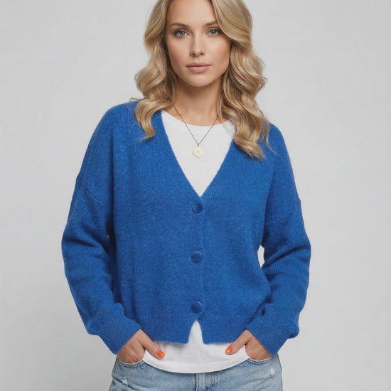 Nova Cardigan by Lauven in vibrant blue worn by a model, perfect for effortless layering and style.