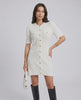 Model wearing the Elysia Mini Dress by Lauven, featuring a casual knit design and single-breasted button closure.