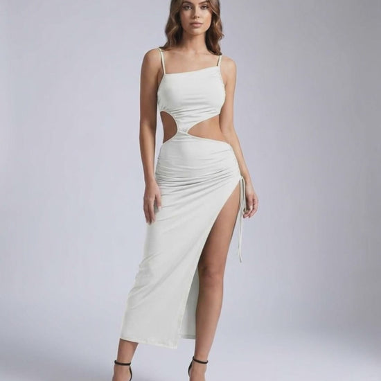 Orion Midi Dress featuring sleek cut-out design, ruched detail, and bold side slit by Lauven.
