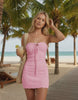 Mila Mini Dress by Lauven in soft pink, knitted halter neck, perfect for beach outings, showcasing ribbing detail.