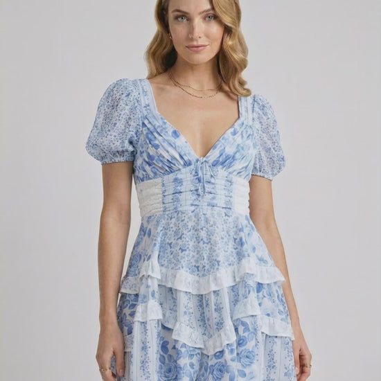 Azure Mini Dress by Lauven, features blue floral print, tiered ruffles, and flattering A-line silhouette.