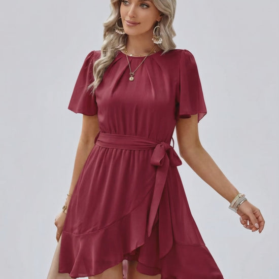 Burgundy Ruffle Dress by Lauven featuring a flattering waist tie and delicate flutter sleeves.