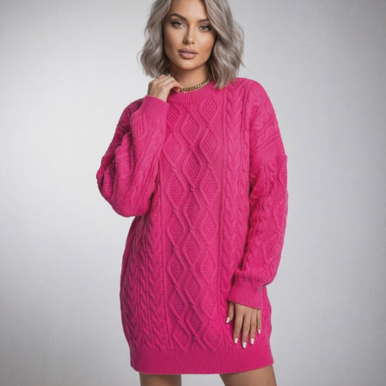 Luna Mini Dress by Lauven in vibrant pink cable knit with relaxed silhouette and long sleeves.