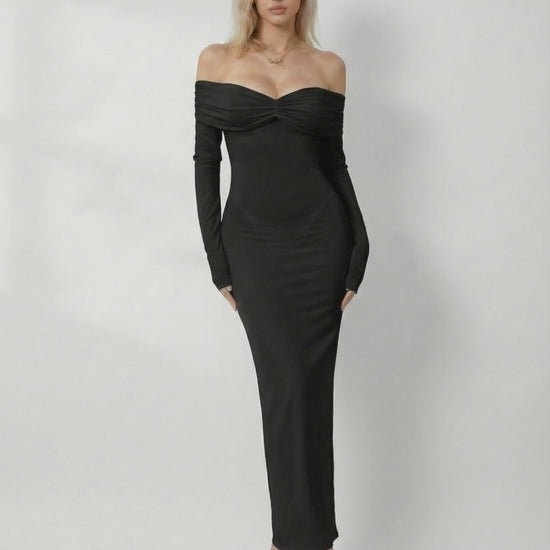 Noir Maxi Dress by Lauven, showcasing a sleek off-shoulder design with a slim fit and elegant black fabric.