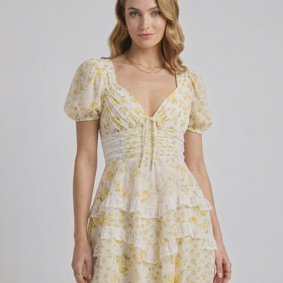 Soleil Mini Dress by Lauven, soft floral print, tiered ruffles, flattering A-line silhouette for a romantic and elegant look.