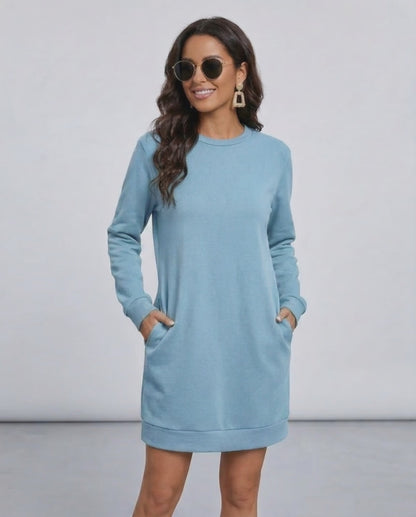Celeste Mini Dress by Lauven in light blue, showcasing a casual O neck long sleeve sweatshirt style with pockets.
