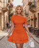 Aurelia Mini Dress in vibrant orange with textured stretch fabric, asymmetrical neckline and tiered hem by Lauven.
