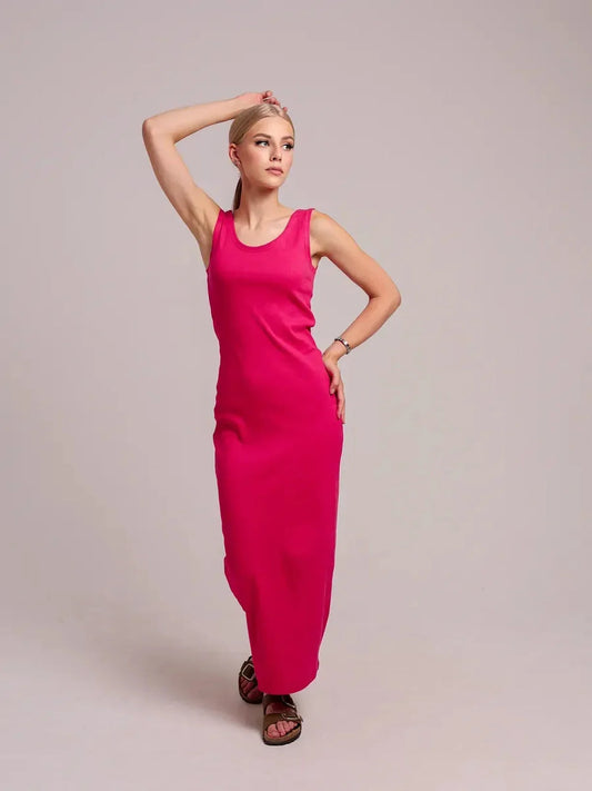 Model wearing a fuchsia Radiance Maxi Dress, showcasing its sleek design and comfortable fit.