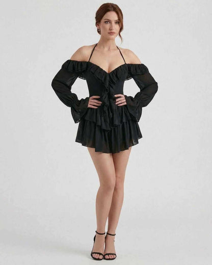 Ravelle Mini Dress by Lauven – Black halter ruffle mini dress with sheer sleeves and layered details.