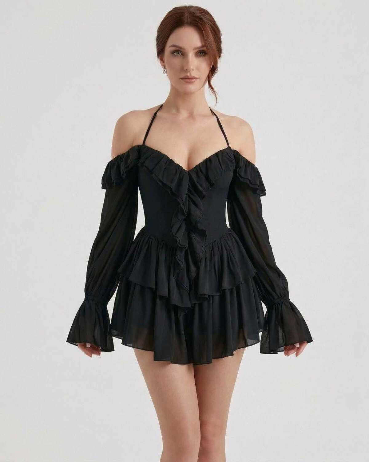 Ravelle Mini Dress by Lauven – Black halter ruffle mini dress with sheer sleeves and layered details.