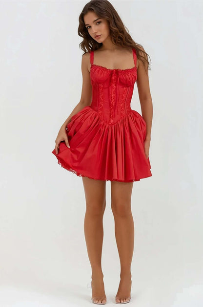 Red mini dress with corset details and a flared skirt, perfect for summer parties and evening events.