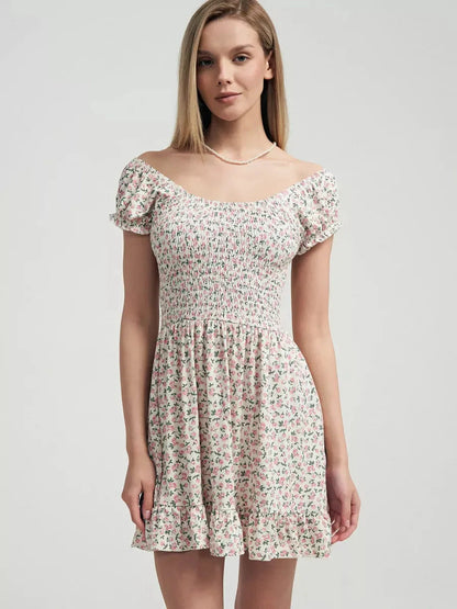 Romantic Blush Blossom summer dress with smocked bodice and pink floral print on milk-white fabric.