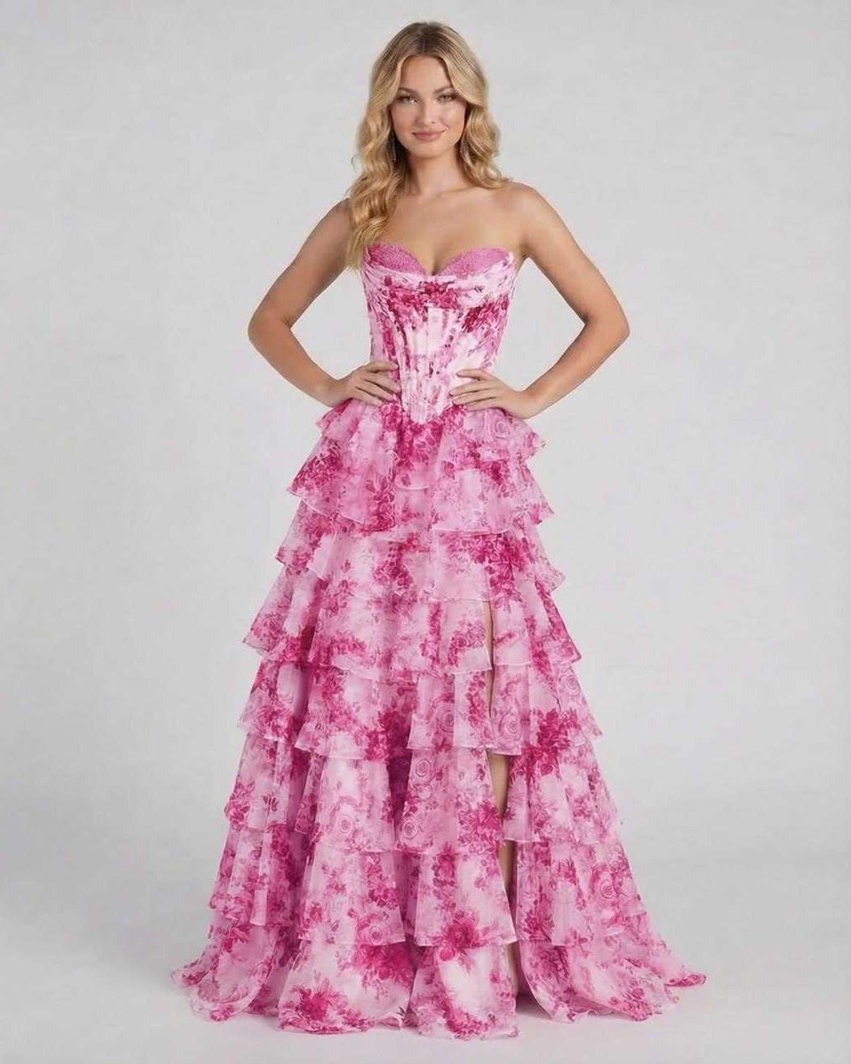 Rosalia Maxi Dress by Lauven, a romantic pink floral tiered chiffon gown with a high slit and structured corset bodice.