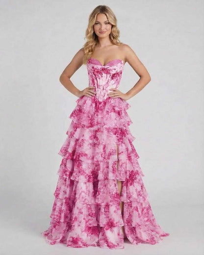 Rosalia Maxi Dress by Lauven, a romantic pink floral tiered chiffon gown with a high slit and structured corset bodice.