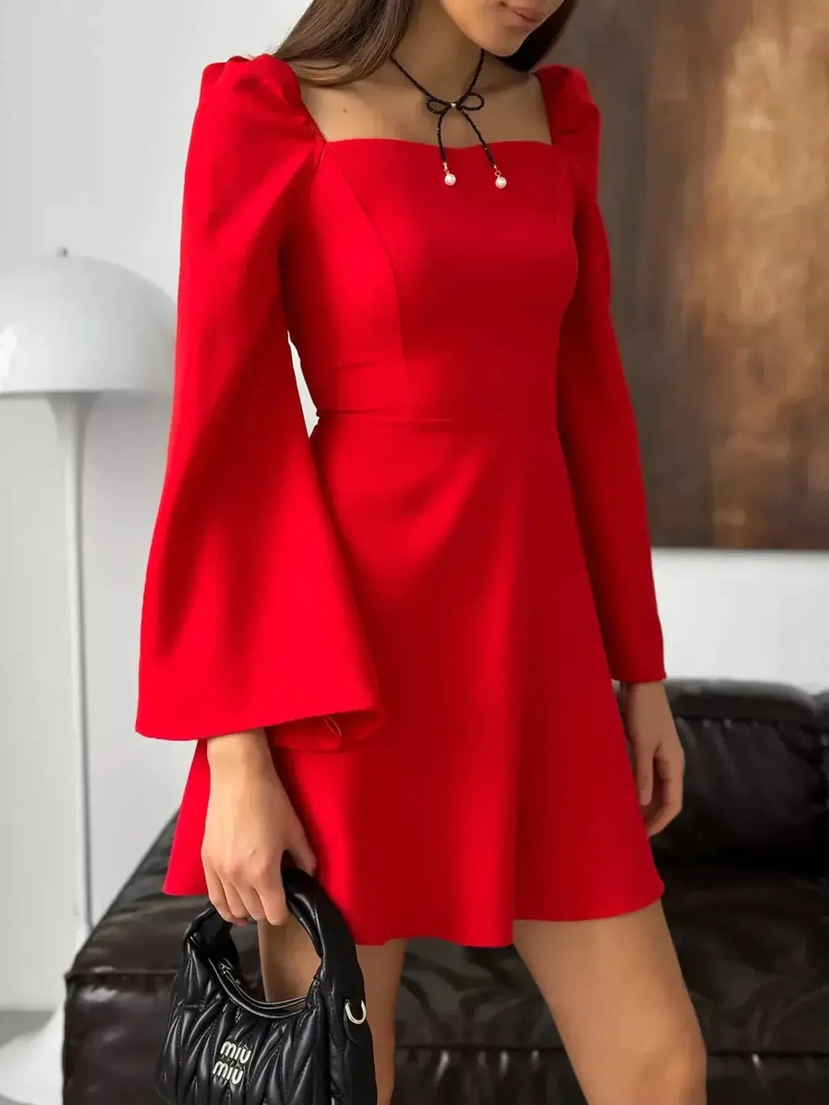 Ruby Flare red mini dress with square neckline and puff sleeves, perfect for weddings and special occasions.