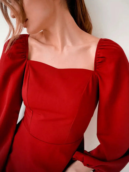 Elegant ruby flare mini dress with fitted bodice, flared skirt, and puff sleeves, perfect for parties and weddings.