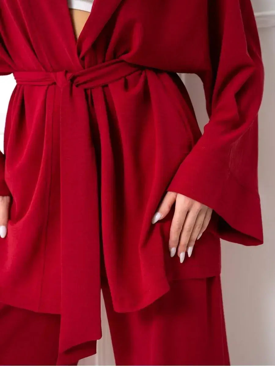 Ruby Suit Set by Lauven, featuring an oversized red jacket with belted waist and side pockets, perfect for stylish comfort.