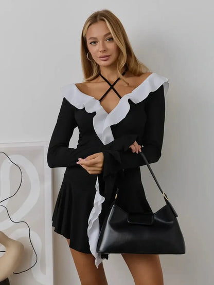 Ruffle Affair mini dress with crisscross halter neckline, long sleeves, and white ruffle detail; perfect for weddings or parties.