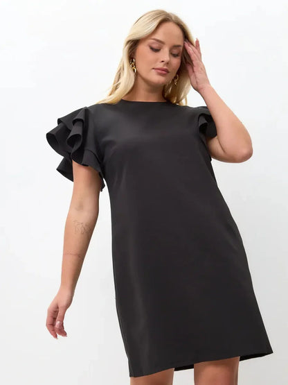 Black mini dress with layered ruffle sleeves, combining elegance and comfort for warm-weather wear.