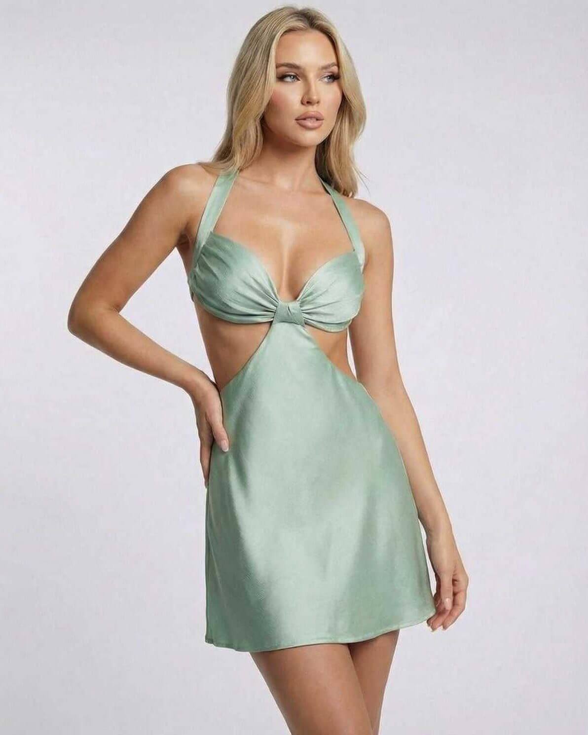 Sage Mini Dress by Lauven featuring halter neck and cut-out detail in soft sage green satin.