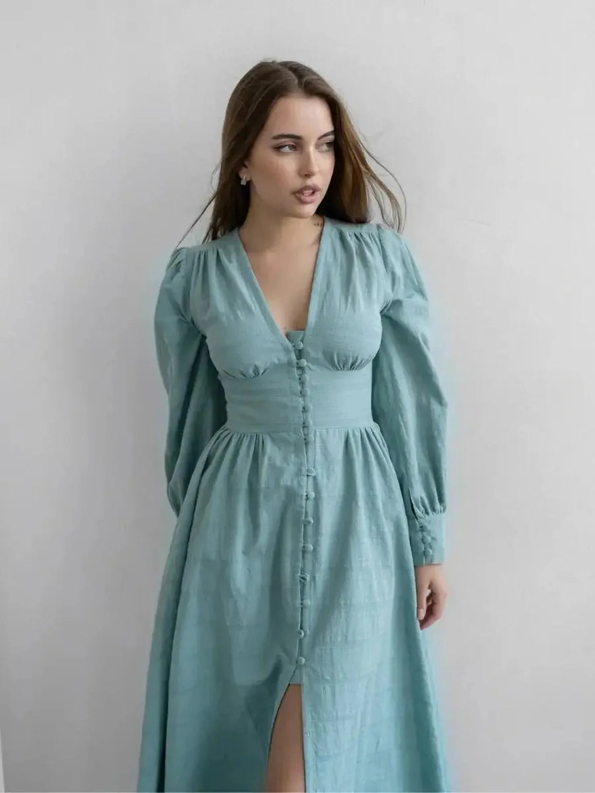 Sage Muse Maxi Dress in elegant sage green with a flattering silhouette and graceful fabric-covered buttons.